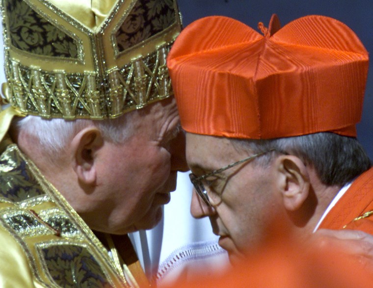 ARGENTINE NEW CARDINAL BERGOGLIO KISSES POPE JOHN PAUL II DURING A CONSISTORY CEREMONY.