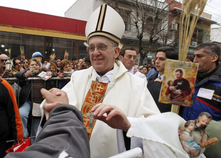 Image: File photo of Archbishop of Buenos Aires Cardinal Jorge Mario Bergoglio greeting worshippers, in the Buenos Aires neighbourhood of Liniers