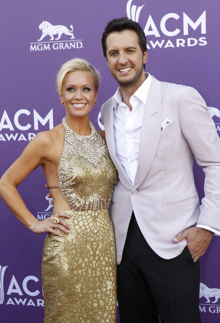 Image: Singer Luke Bryan and wife Caroline arrive at the 48th ACM Awards in Las Vegas