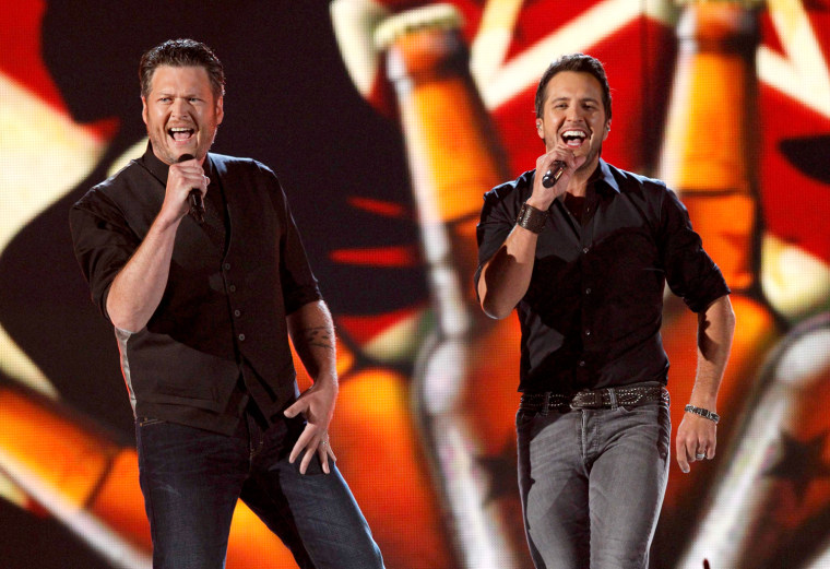 Image: Hosts Blake Shelton and Luke Bryan perform \"Boys Round Here\" at the 48th ACM Awards in Las Vegas