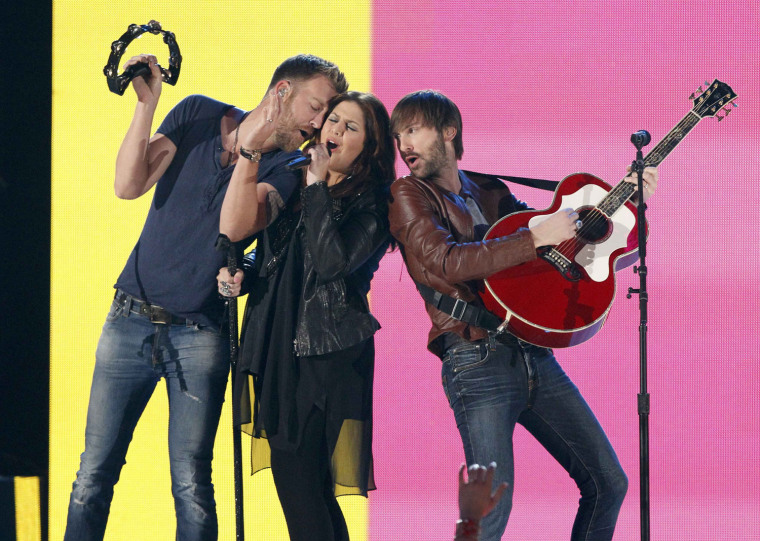 Image: Hillary Scott, Charles Kelley and Dave Haywood of Lady Antebellum perform the song \"Downtown\" during the 48th ACM Awards in Las Vegas