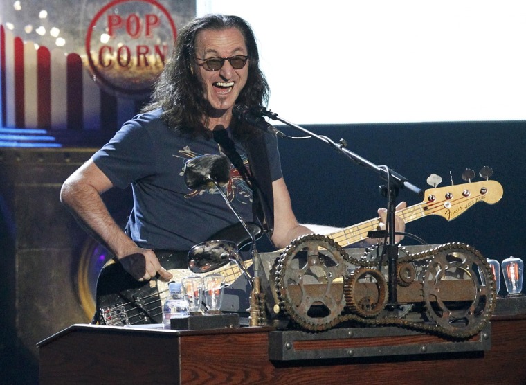 Image: Geddy Lee, of Rush, performs during his band's induction at the 2013 Rock and Roll Hall of Fame induction ceremony in Los Angeles