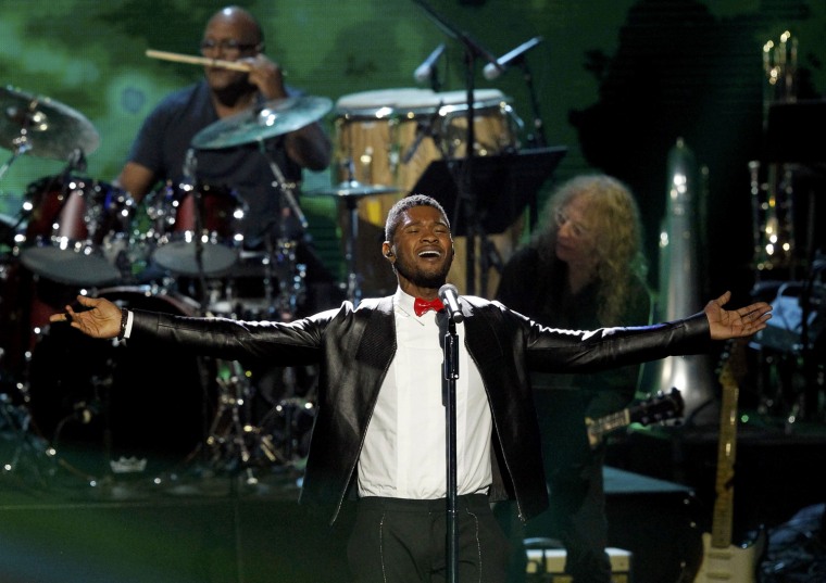 Image: Usher performs during Quincy Jones' induction at the 2013 Rock and Roll Hall of Fame induction ceremony in Los Angeles