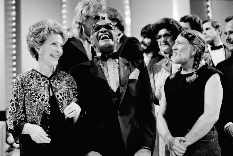 **FILE**Then-first lady Nancy Reagan, left, gets a laugh with Ray Charles, center, and Willie Nelson, right, and other entertainers at a salute to country music at Constitution Hall in Washington on March 16, 1983. Charles died Thursday, June 10, 2004, a spokesman said. He was 73.(AP Photo/Ira Schwarz)


--------------------------------------------------------------------------------