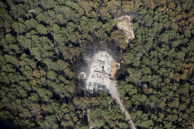 Image: An aerial view of a destroyed house surrounded by dense forest in the aftermath of the Black Forest Fire in Black Forest, Colorado