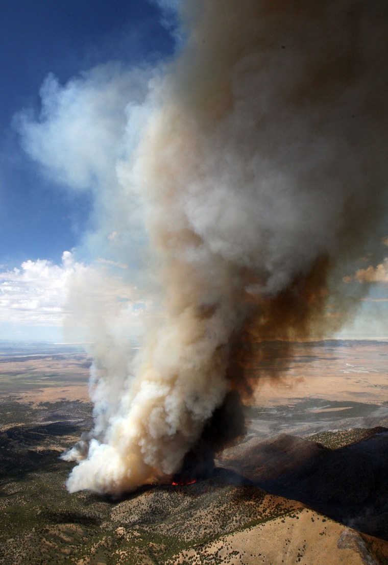 The Patch Springs fire burns at the south end of the Stansbury Mountains, near Tooele Utah, Monday, Aug. 12, 2013. The 4.5 square-mile Patch Springs Fire grew overnight as it approached the nearby Goshute Indian Reservation. (AP Photo/Deseret News, Ravell Call)