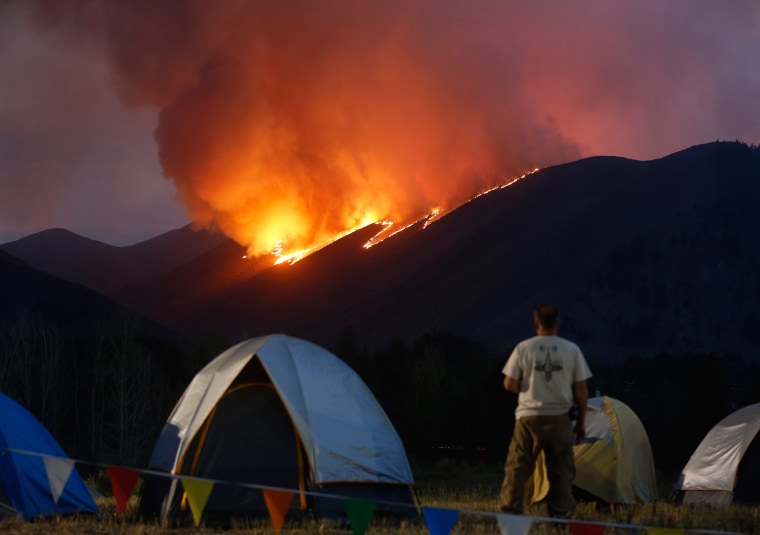 Image: Flames blaze down a ridge as the Beaver Creek wildfire rages outside Hailey