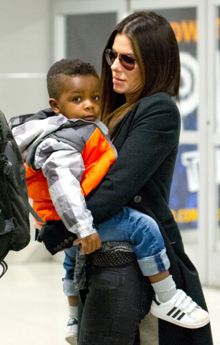 Sandra Bullock with her son Louis arrive at JFK airport in NYC