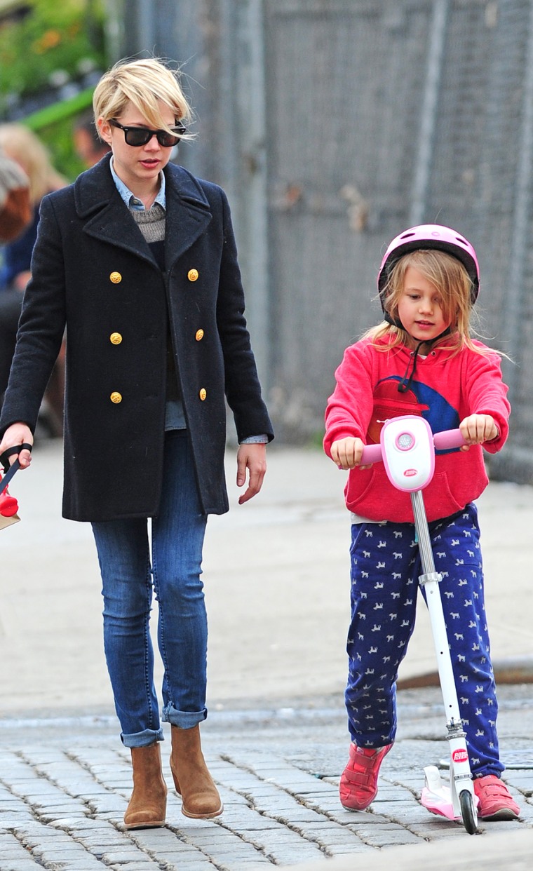 Michelle Williams walks her dog Lucky accompanied by daughter Matilda Ledger riding a scooter in Brooklyn, New York