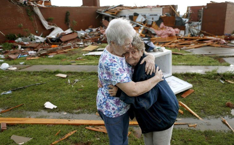 Jerry Dirks, at right, hugs her friend Earlene Langley after a tornado hit Dirks' home just south of Carney Okla., on Sunday, May 19, 2013. Dirks was in her cellar at the time the tornado hit. Photo by Bryan Terry, The Oklahoman