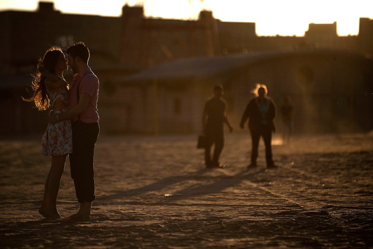 Image: A couple embraces on the beach at Coney Island in the Brooklyn Borough of New York