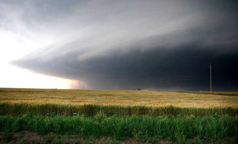 Image: A large storm cell, which reportedly produced a multiple vortex tornado, passes south of El Reno, Oklahoma