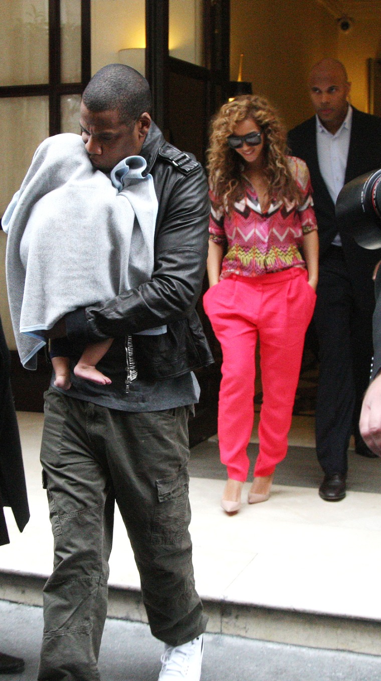 American singer Jay Z and his wife Beyonce are leaving fouquet's hotel in Paris with their son blue Ivy Carter
