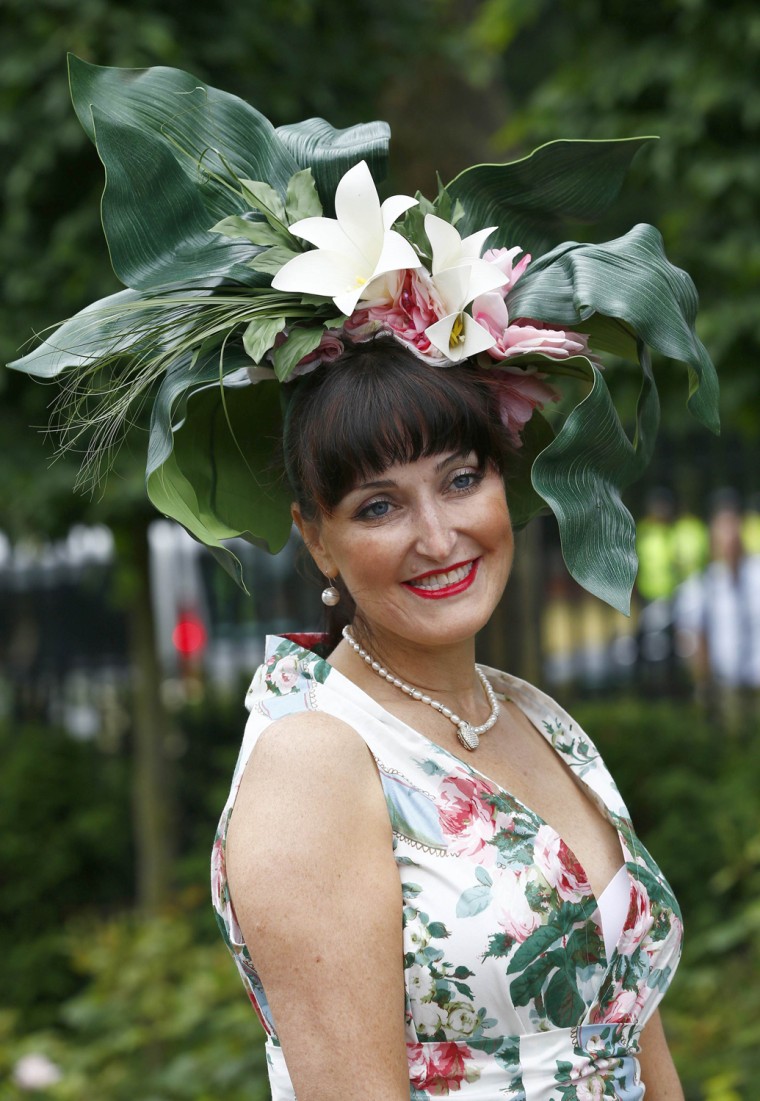 Image: A racegoer arrives for Ladies' Day at the Royal Ascot horse racing festival at Ascot