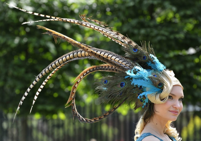 Image: A racegoer arrives on the second day of the Royal Ascot horse racing festival at Ascot