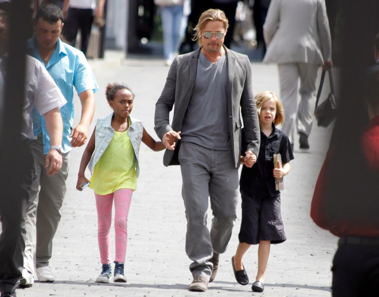 Image: U.S. actor Pitt walks with his daughters Shiloh and Zahara near the Kremlin in Moscow