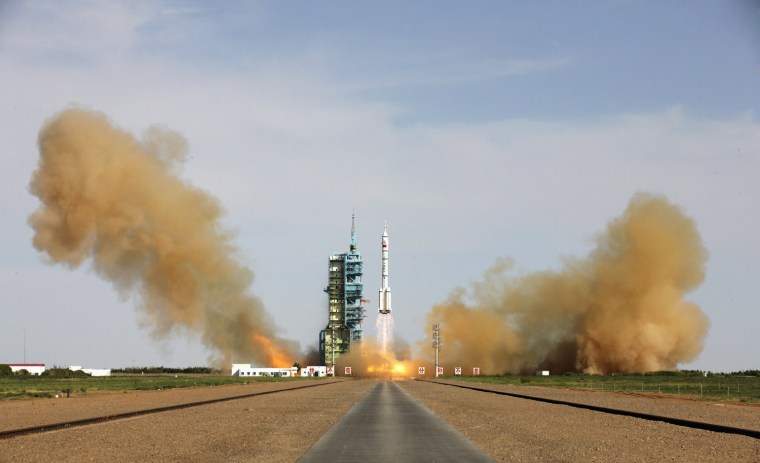 Image: The Long March 2-F rocket loaded with Shenzhou-10 manned spacecraft carrying Chinese astronauts Nie Haisheng, Zhang Xiaoguang and Wang Yaping lifts off from the launch pad in the Jiuquan Satellite Launch Center