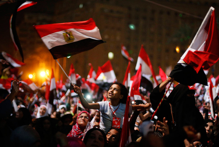 Image: Protesters, who are against Egyptian President Mohamed Mursi, react in Tahrir Square in Cairo