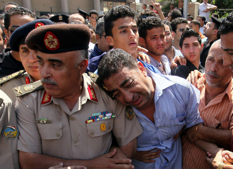 Image: Funeral of Egyptian policemen killed during clashes in Cairo