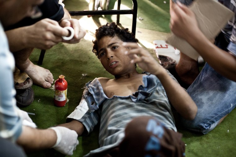 Image: A wounded boy is treated in Cairo,Egypt