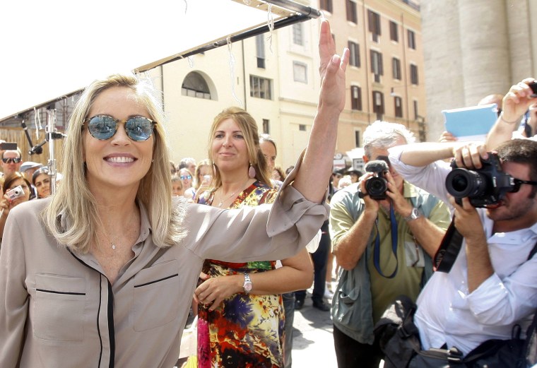 Image: U.S. actress Sharon Stone waves as she arrives for Italian director Pupi Avati's movie \"Un ragazzo d'oro\" (A golden boy) in Rome