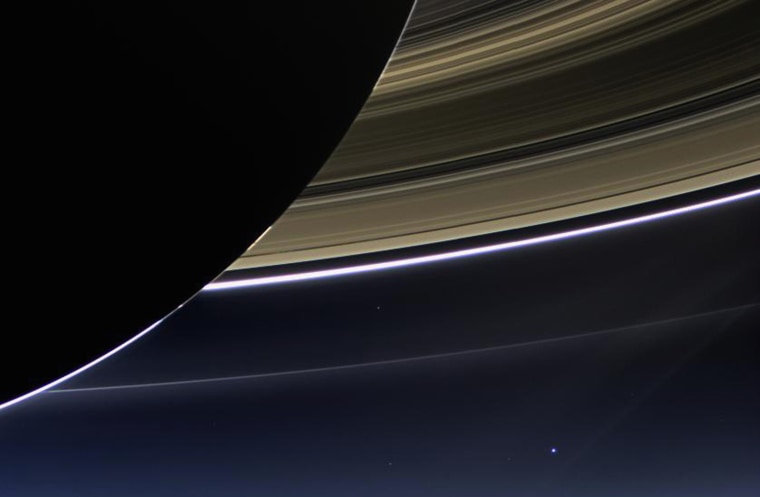 Image: Saturn's rings and our planet Earth and its moon are seen in this NASA handout image
