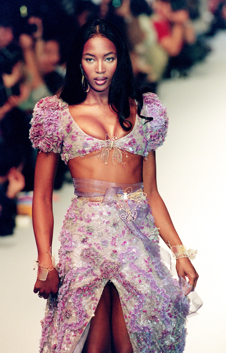 Top model Naomi Campbell displays a dress during t