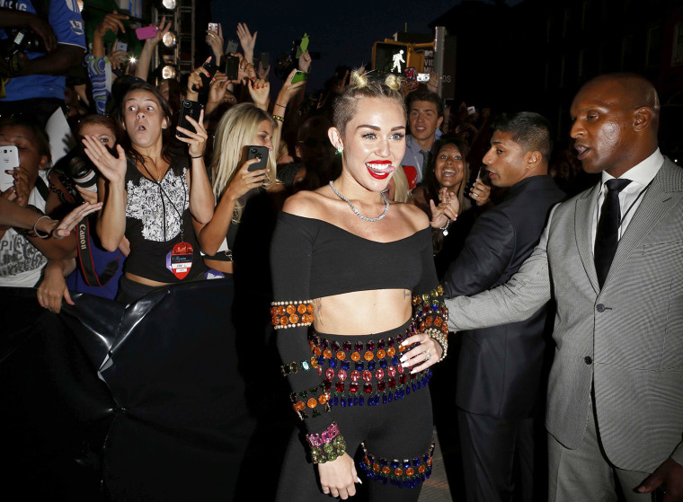 Image: Singer Cyrus arrives at the 2013 MTV Video Music Awards in New York