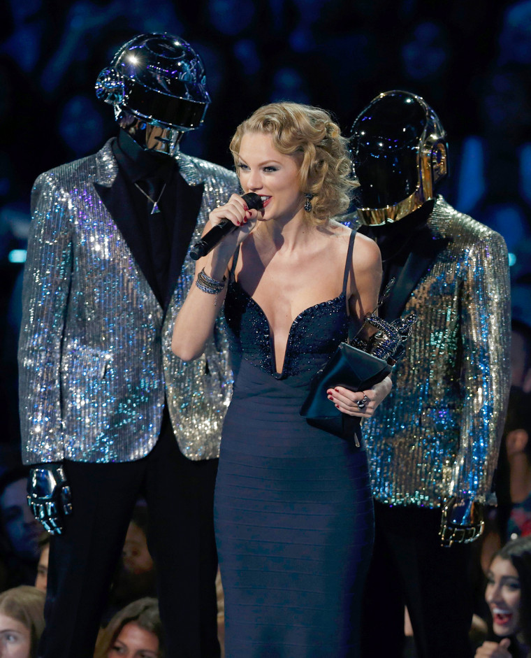 Image: Taylor Swift accepts the award for best female video for \"I Knew You Were Trouble\" as presenters Daft Punk stand on stage during the 2013 MTV Video Music Awards in New York