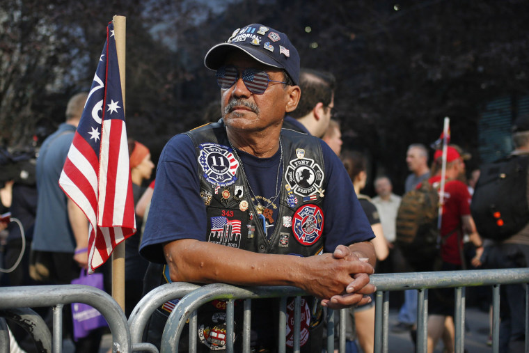 Image: Jose Rosales observes a moment of silence honoring the victims of the September 11attacks outside the World Trade Center site in New York