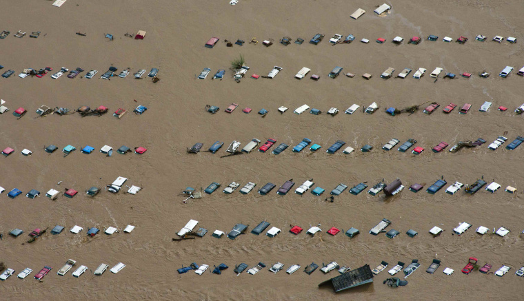Image: An aerial view of vehicles submerged in flood waters along the Sough Platte River near Greenley