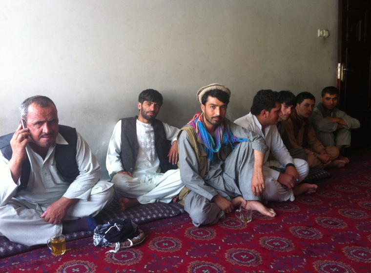 Constituents wait to meet with Almas at his Kabul office.
