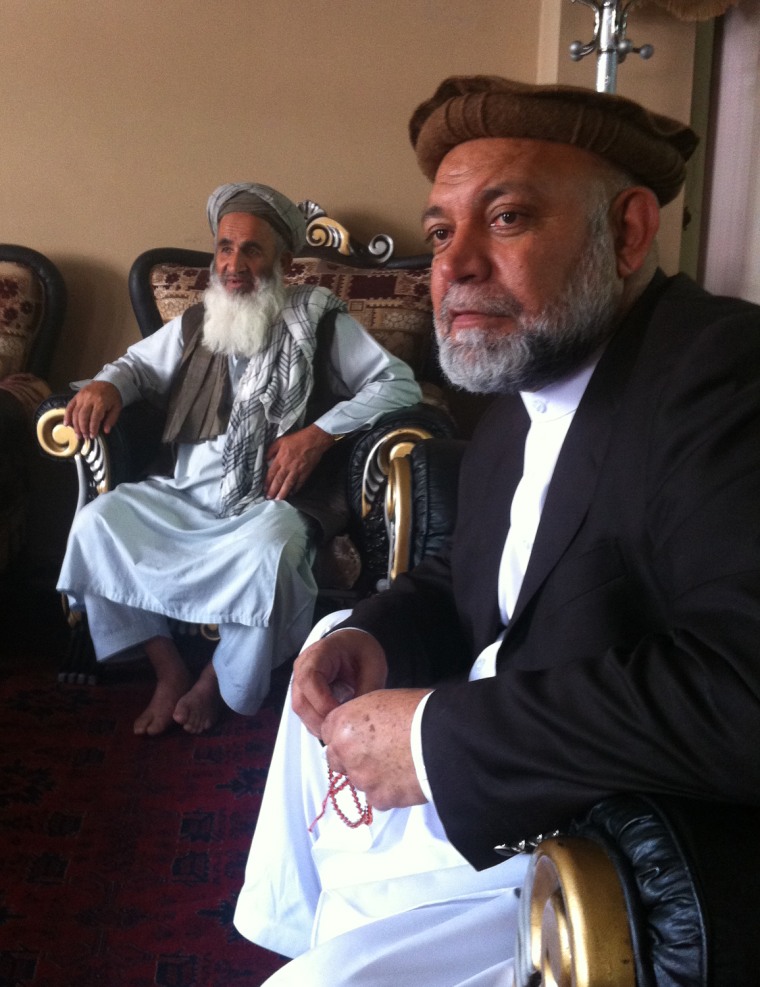 Almas meets a tribal elder at his office in Kabul.