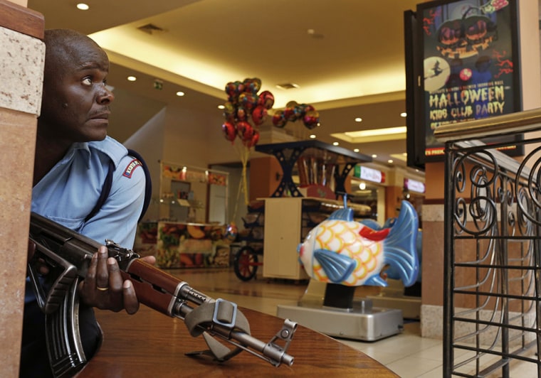 Image: A police officer tries to secure an area inside the Westgate Shopping Centre where gunmen went on a shooting spree in Nairobi