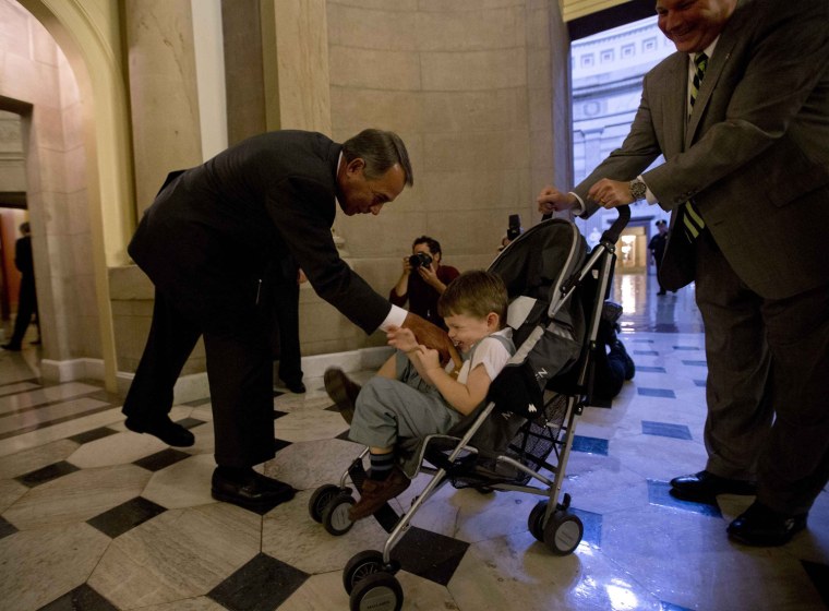 Image: U.S. House Speaker John Boehner tickles John Griffin III in Washington