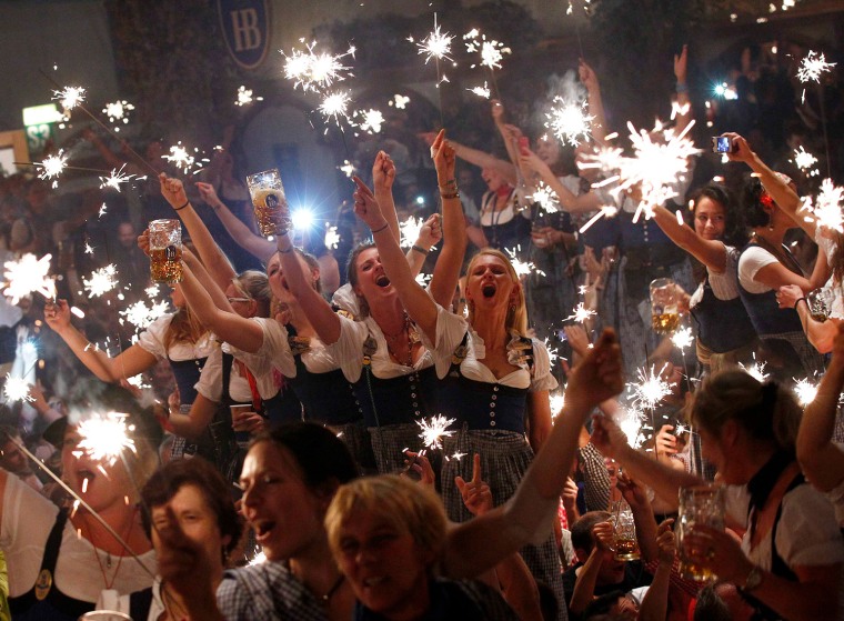Image: Oktoberfest waitresses hold sparklers while celebrating the end of the world's biggest beer festival, the 180th Oktoberfest, in Munich