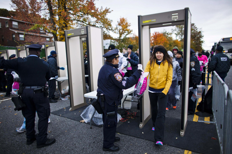 Image: Runners pass through scanners upon arrival for the New York City Marathon