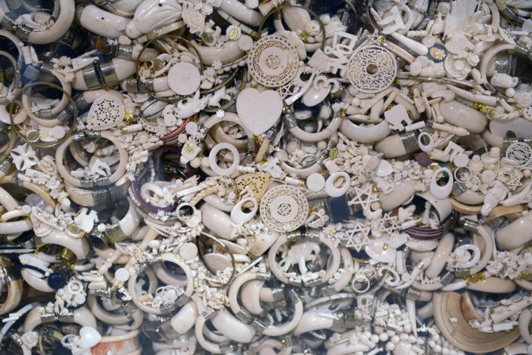 Image:  A case full of jewelry carved from ivory sits on display in the National Wildlife Property Repository in Denver.
