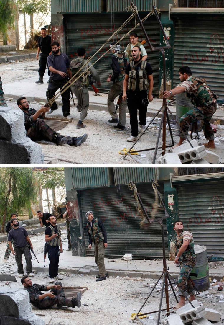 Image: Combination photo of members of the Free Syrian Army using a catapult to launch a homemade bomb during clashes with pro-government soldiers in the city of Aleppo