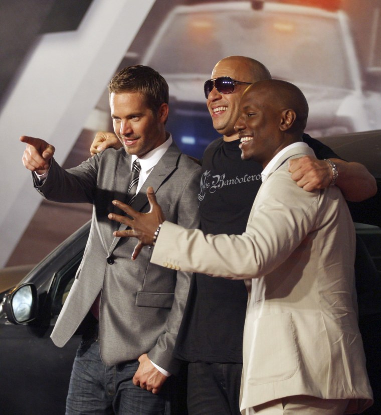 Image: Actors Paul Walker, Vin Diesel and Tyrese Gibson pose at the world premiere of \"Fast Five\" in Rio
