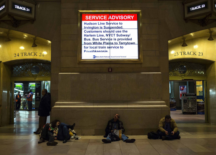 Image: People wait at Grand Central Station following a Metro-North train derailment in the Bronx borough of New York