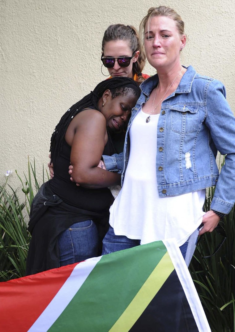 Image: Mourners react outside the home of South Africa's former President Nelson Mandela in Houghton
