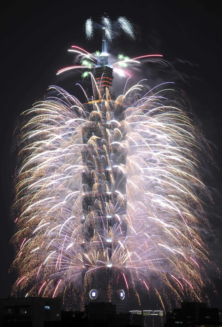 Image: Fireworks explode from Taiwan's tallest skyscraper, the Taipei 101 during New Year celebrations in Taipei
