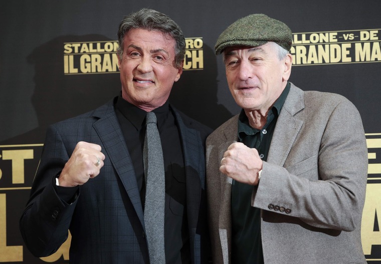 Image: Actors Stallone and De Niro pose during a photocall for the movie \"Grudge Match\" in Rome
