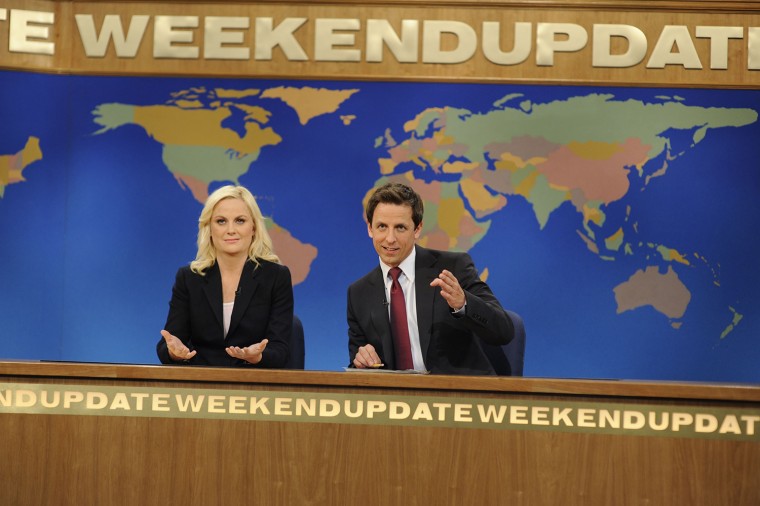 SATURDAY NIGHT LIVE, Amy Poehler, Seth Meyers, Weekend Update, (Season 37, aired February 18, 2012), photo: Dana Edelson / Â© NBC / Courtesy Everett Collection