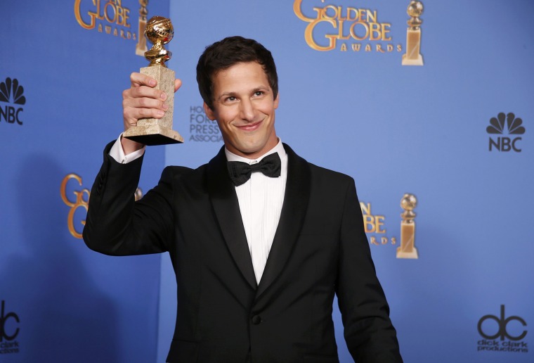 Image: Andy Samberg poses backstage with his award for Best Actor in a TV Series, Musical or Comedy for his role in \"Brooklyn Nine-Nine\" at the 71st annual Golden Globe Awards in Beverly Hills