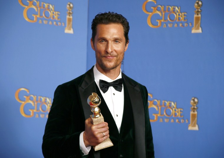 Image: Actor Matthew McConaughey poses backstage with his award for Best Actor in a Motion Picture, Drama for his role in \"Dallas Buyers Club\" at the 71st annual Golden Globe Awards in Beverly Hills