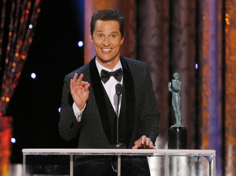 Image: Matthew McConaughey accepts the award for Outstanding Performance by a Male Actor in a Leading Role for his film  \"Dallas Buyers Club\" at the 20th annual Screen Actors Guild Awards in Los Angeles