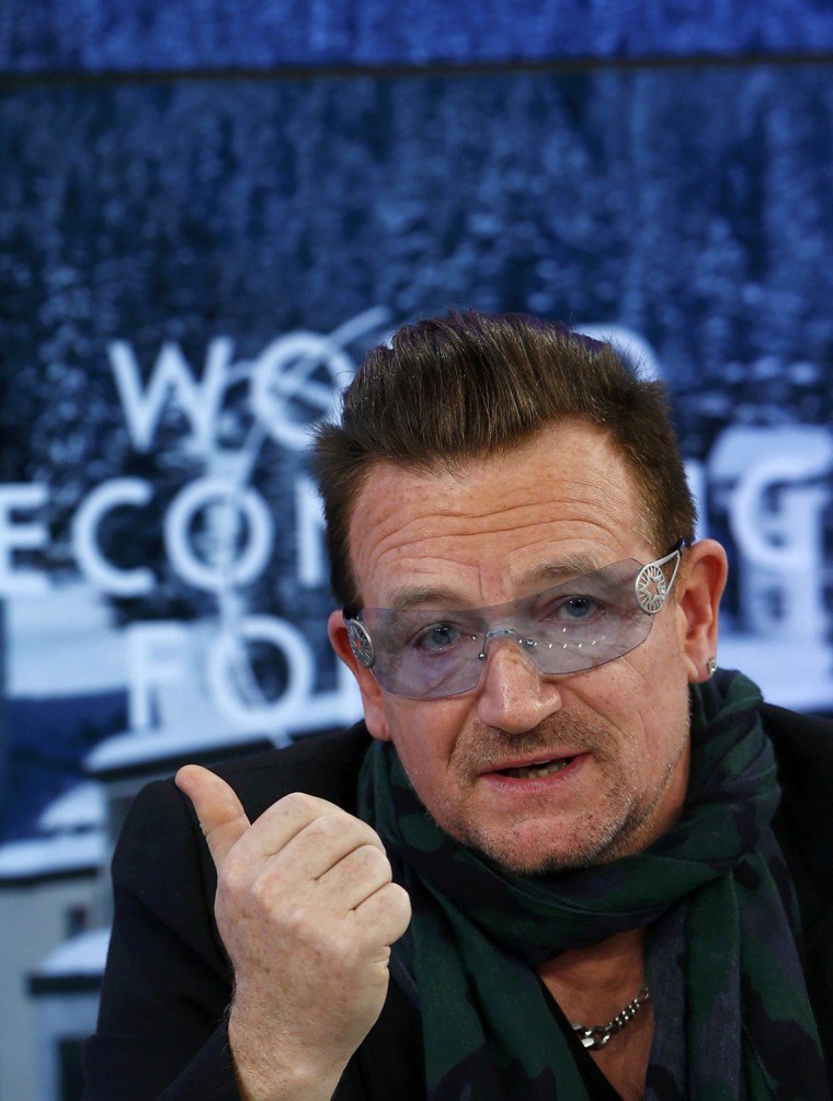 Image: Singer Bono attends a session of World Economic Forum in Davos