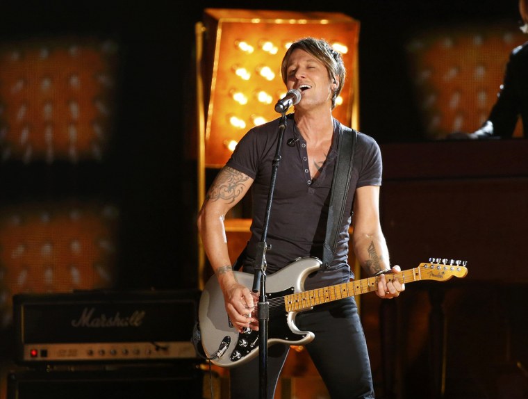 Image: Keith Urban performs \"Cop Car\" at the 56th annual Grammy Awards in Los Angeles